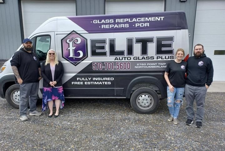 elite autoglass team in front of van