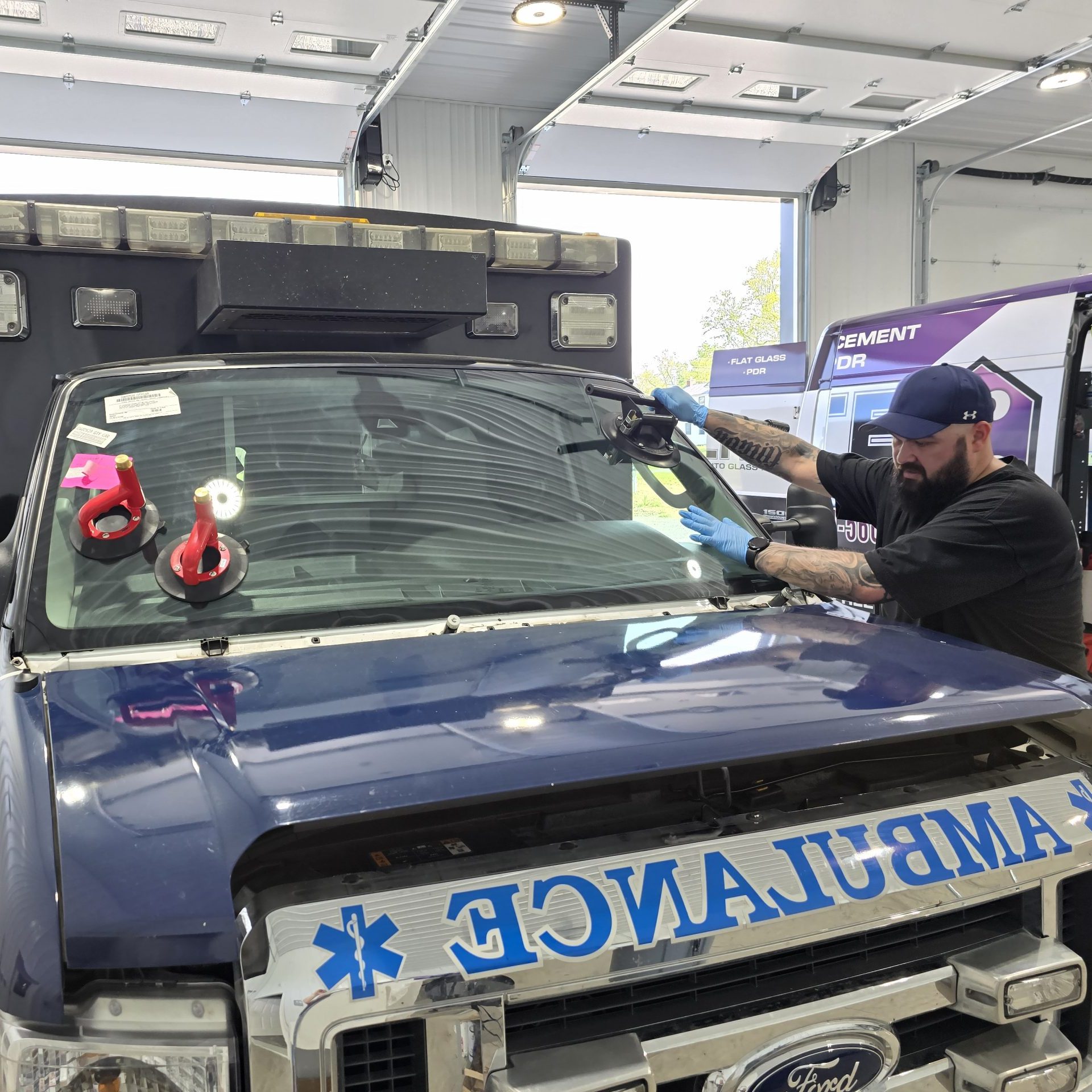 ambulance getting windshield fixed