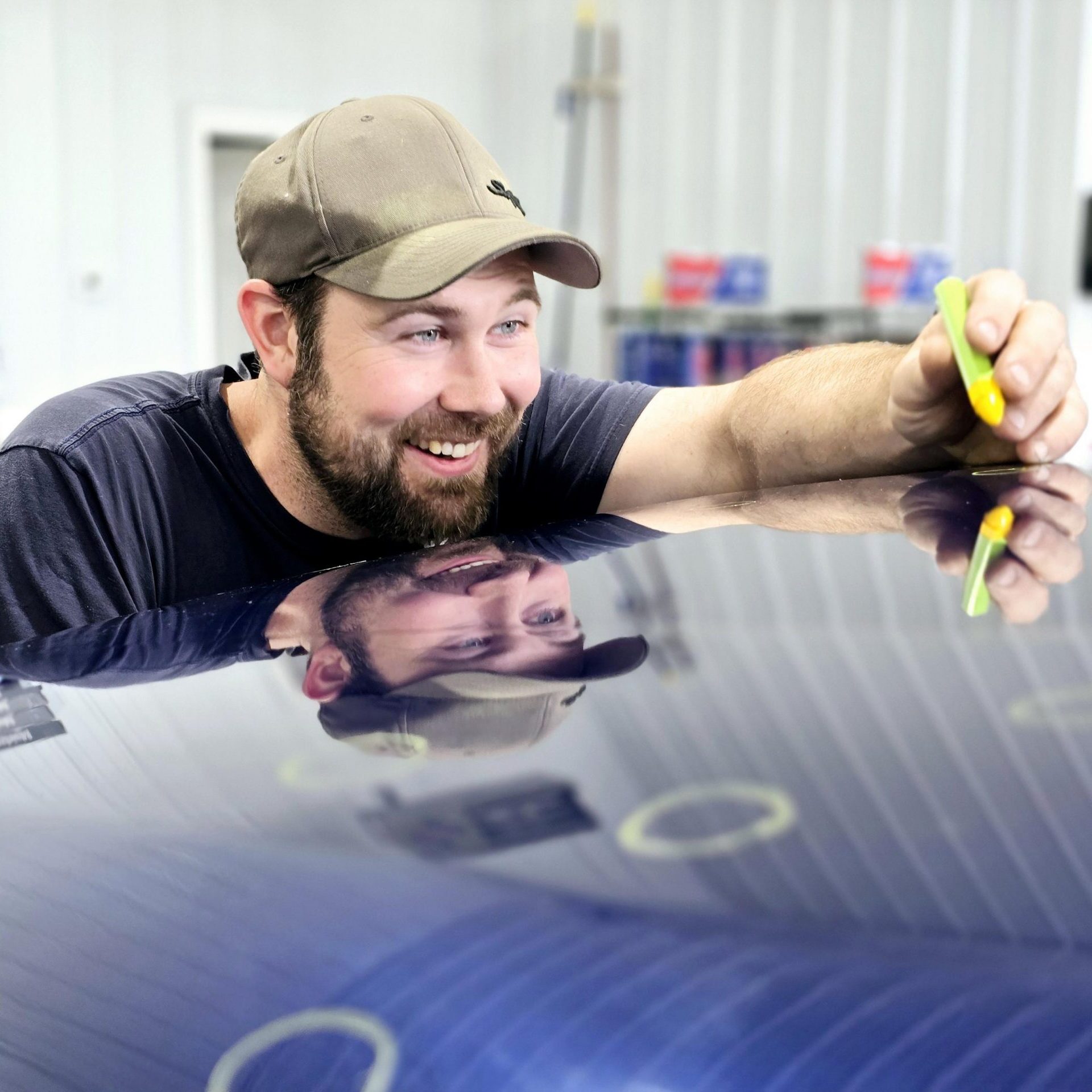 men doing paintless dent repair marking